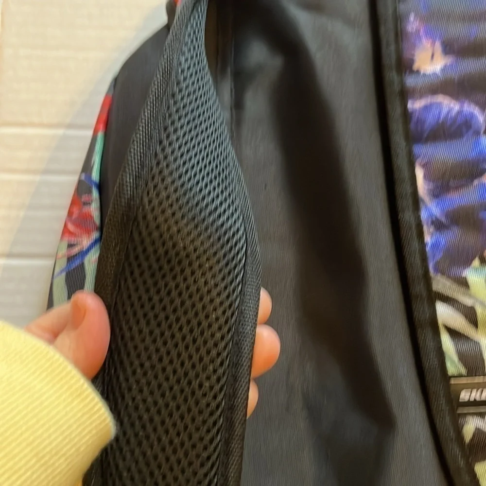 NWT-Skechers-black with multi floral back pack.metal zippers.unisex